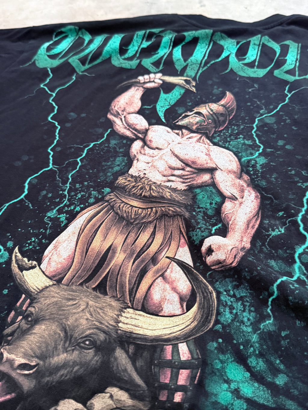 Close-up of the Hercules and the Horn of Abundance back print: Hercules in a crested helmet holding the horn over the bull