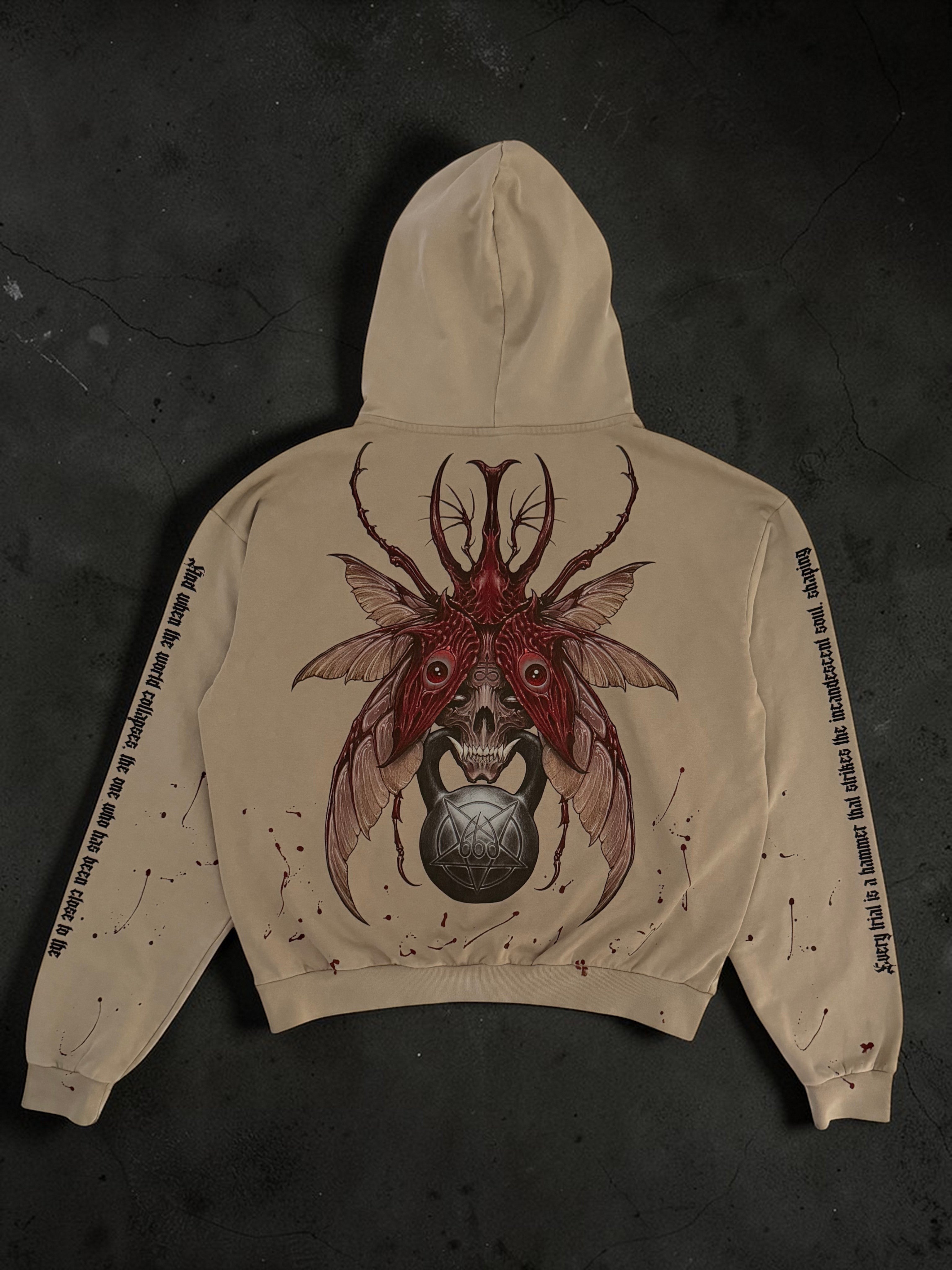 OverPower Strength Wear beige 100% French Terry cotton oversized hoodie with a large graphic of a demonic beetle skull holding a kettlebell.