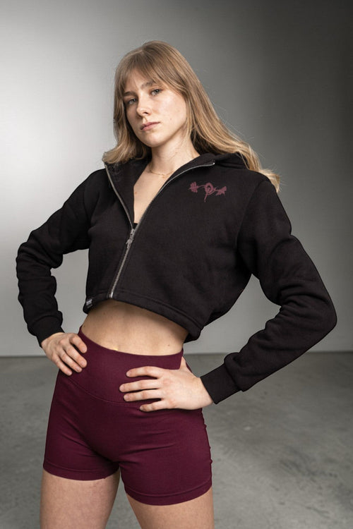 OverPower Strength Wear black cotton fleece crop zip-up hoodie with graphic detail and metal zipper.