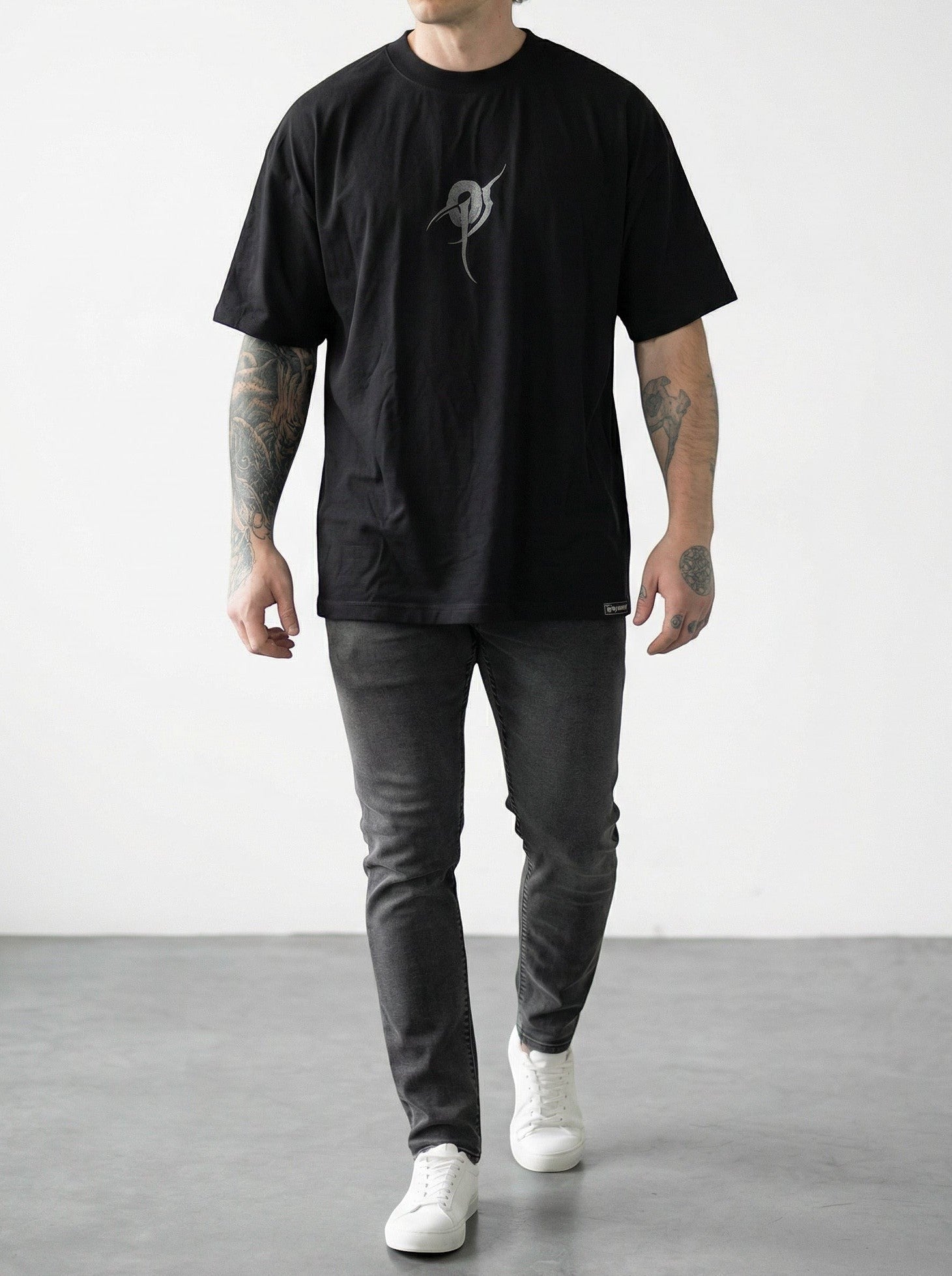 OverPower Strength Wear black oversized cotton blend t-shirt with a grey graphic design and crew neck.