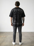 OverPower Strength Wear black oversized tee with a graphic creature and text "The Strongest Never Go Back".