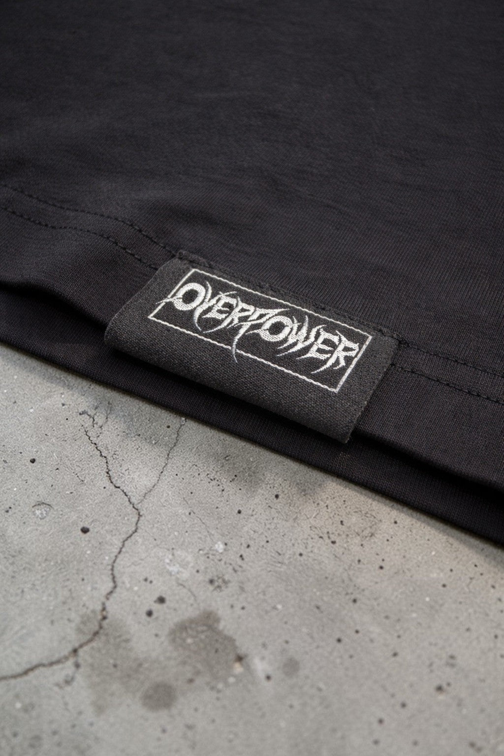 OverPower Strength Wear black oversized cotton-spandex blend gym t-shirt with Hell's Gate graphic detail.