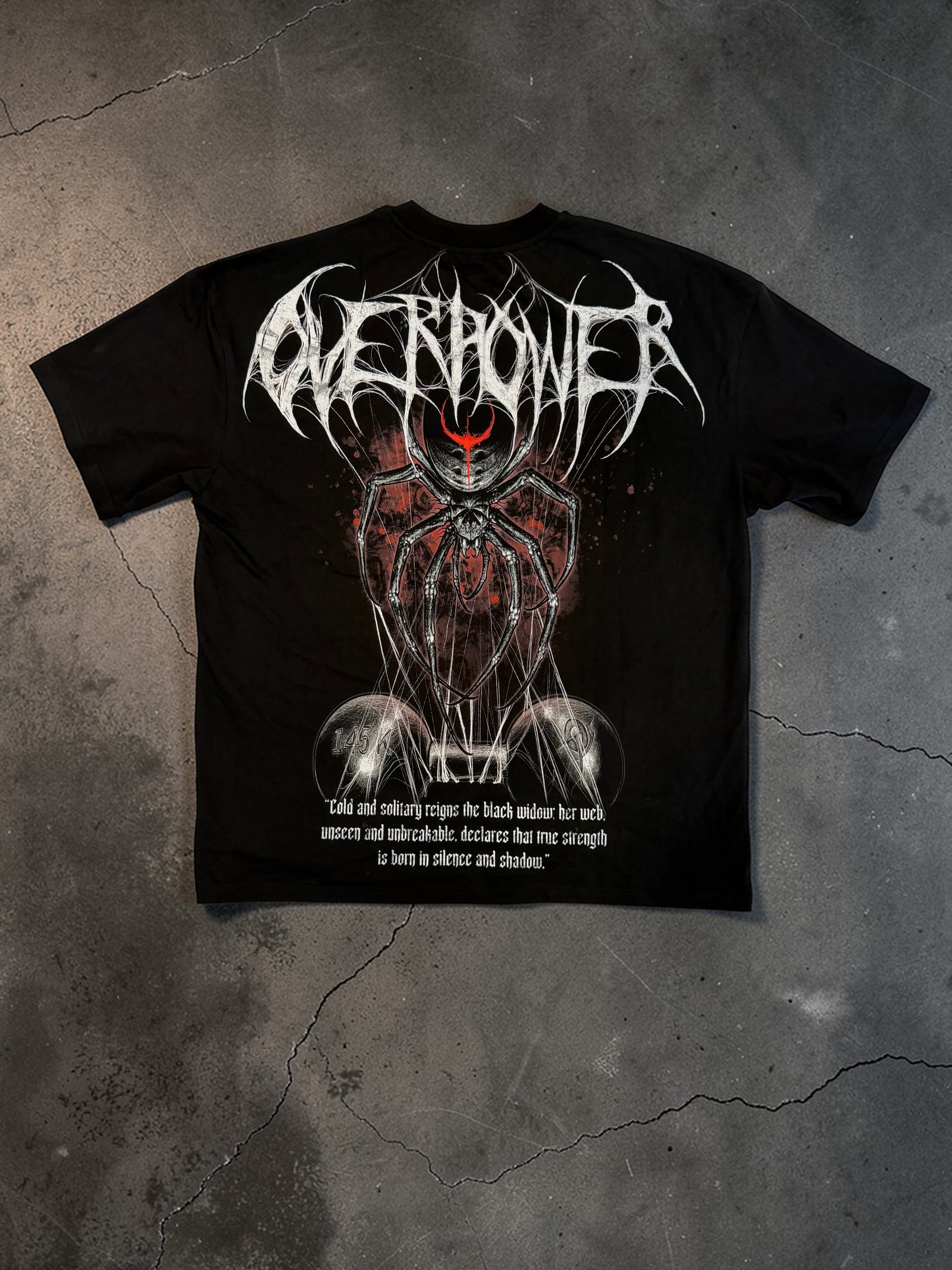 OverPower Strength Wear black oversized cotton tee with a graphic of a black widow spider holding a dumbbell and gothic text.
