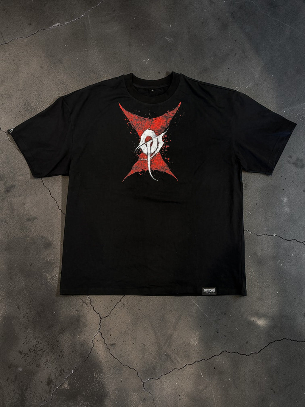 OverPower Strength Wear black oversized heavyweight cotton tee with a red and white spider graphic.