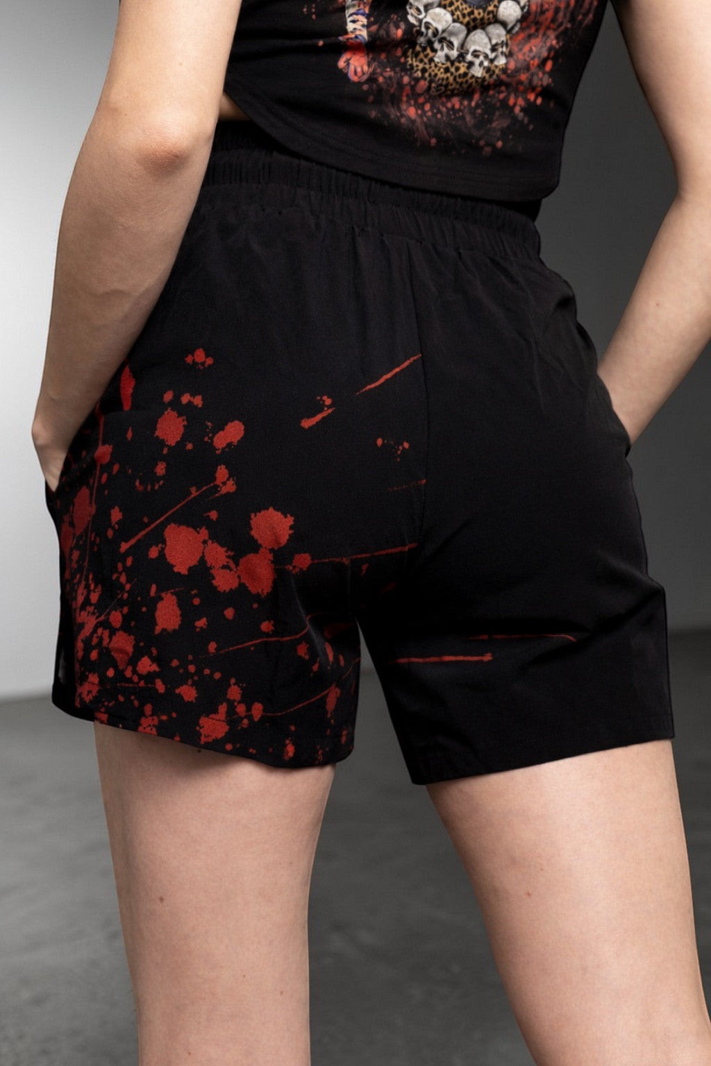 OverPower Strength Wear unisex black nylon/spandex shorts with red blood splatter graphic. Ideal for MMA, BJJ, and training.