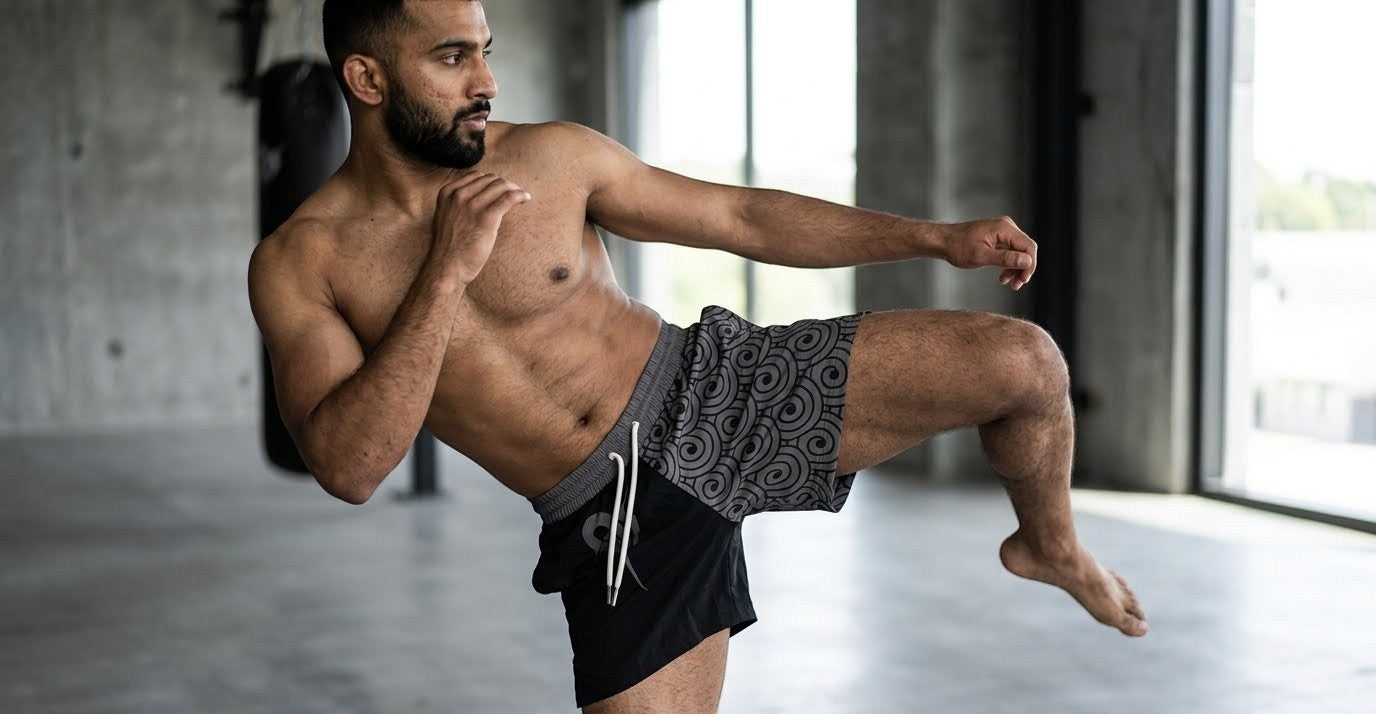 OverPower Strength Wear unisex fighter shorts in black with a grey Japanese wave pattern. Lightweight nylon/spandex blend for martial arts.