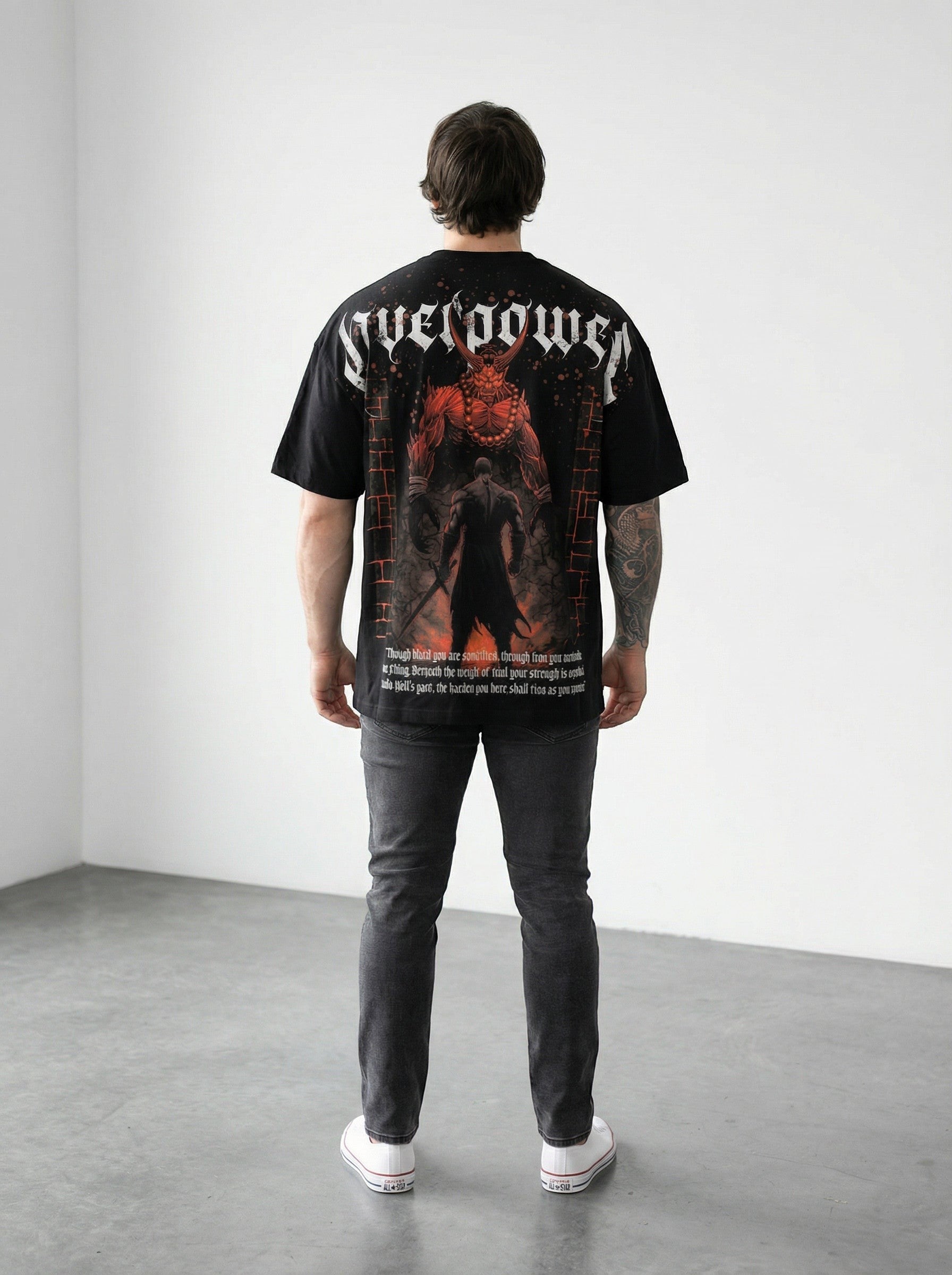 OverPower Strength Wear black oversized graphic tee with Hell's Gate artwork and text. 95% cotton/5% spandex blend.